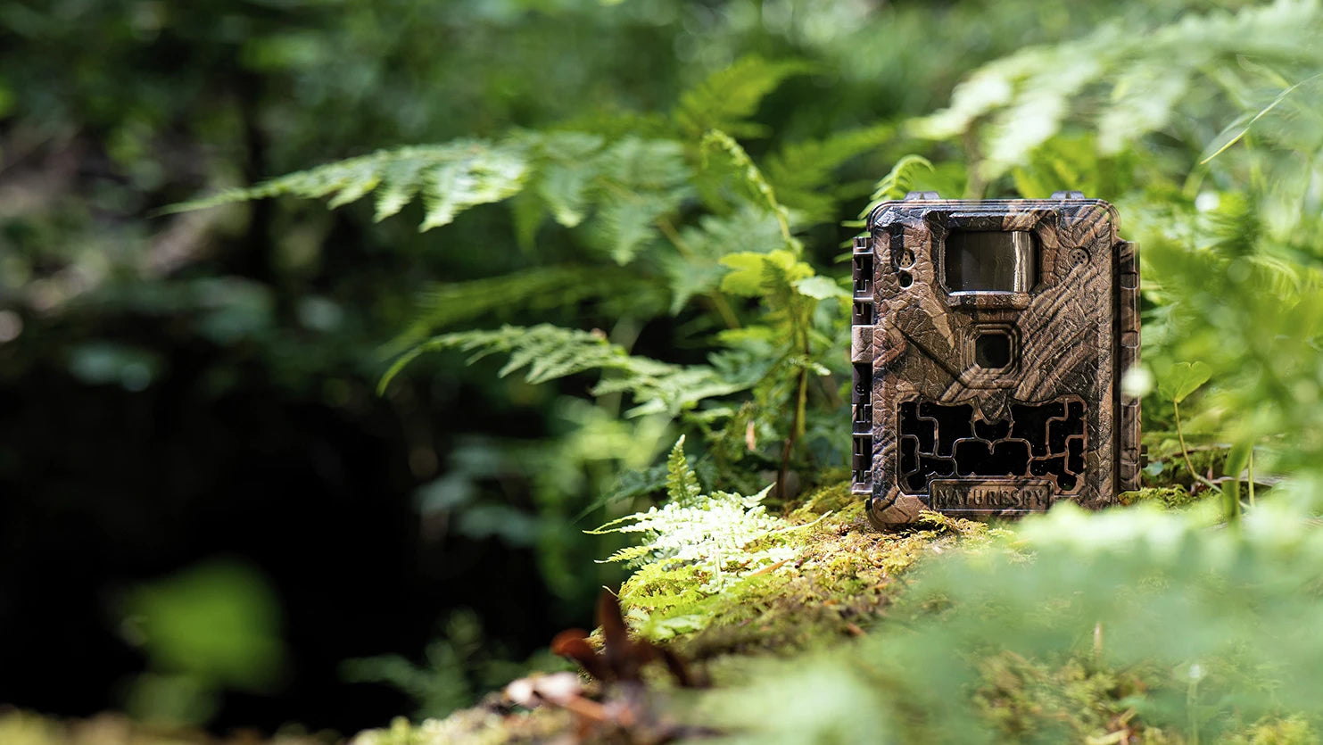 Ursus Nova Wildlife camera sitting amongst foliage